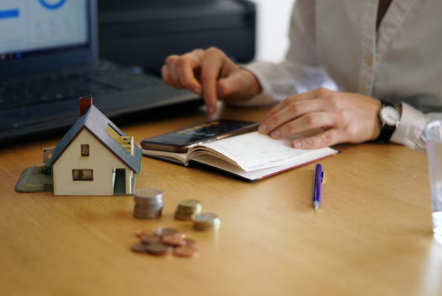Homeowner reviewing finances to decide whether to pay off your mortgage early.