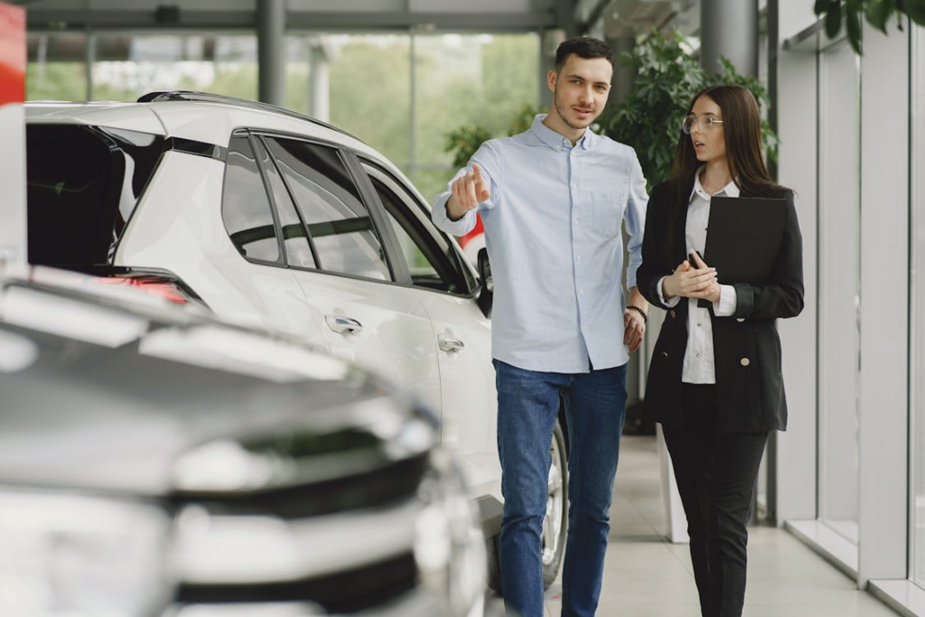 leasing vs buying a car financially comparison at dealership showroom